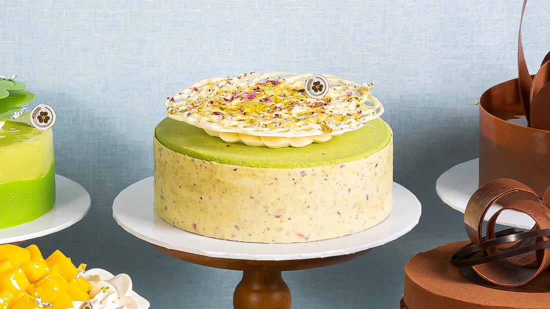 Miyabi Rich Pistachio Ber cake displayed with other Miyabi cakes against a pale blue backdrop