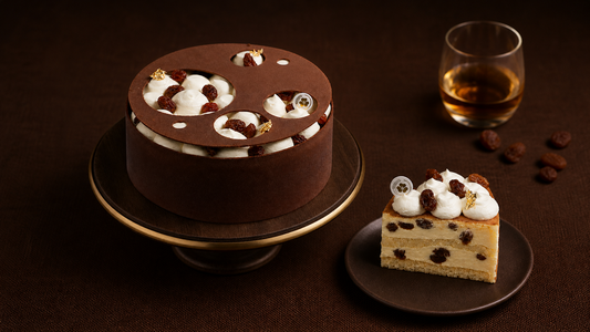Miyabi Rum and Raisin whole cake and a slice showing creamy layers and raisins