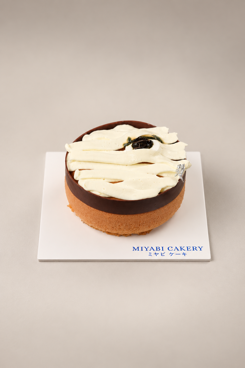 Mummified Peanut Tomb: peanut chocolate mousse cake with white mummy-style bands and an eye. Contains alcohol.