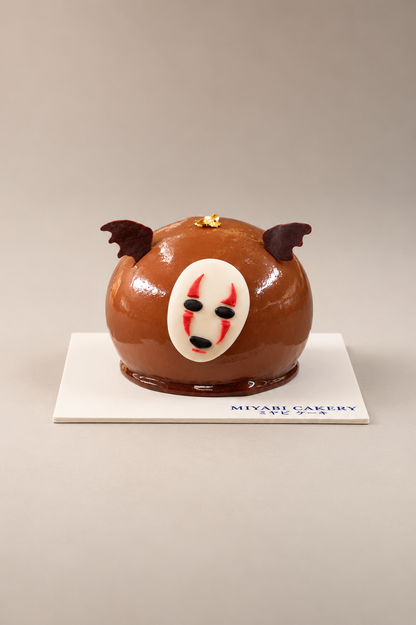 Spirit of Darkness: chocolate-glazed dome with a white mask and bat-wing decorations. Contains alcohol.