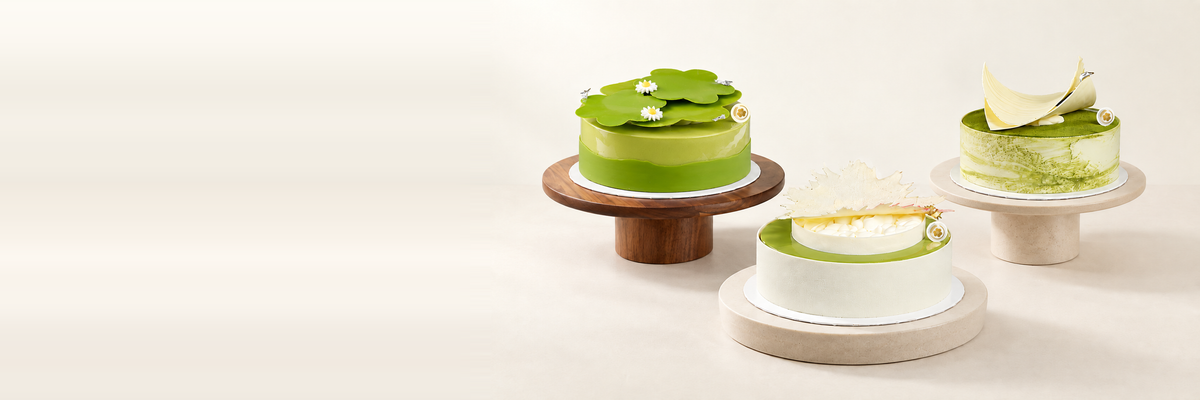 Three Miyabi matcha cakes with original gold logos on warm ivory, arranged to the right