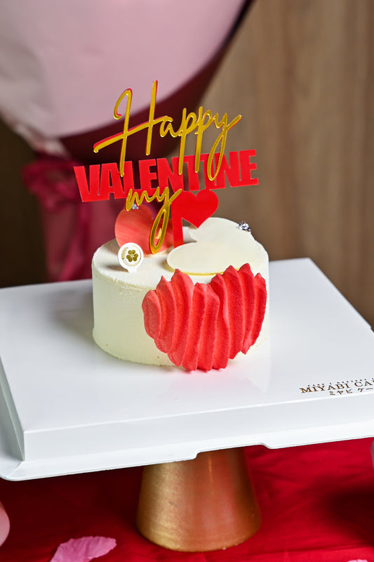 Elegant heart-shaped Valentine’s cake with festive topper, crafted by Miyabi Cakery in Kuala Lumpur.